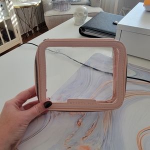 Clear and pink Beauty Pie cosmetic bag